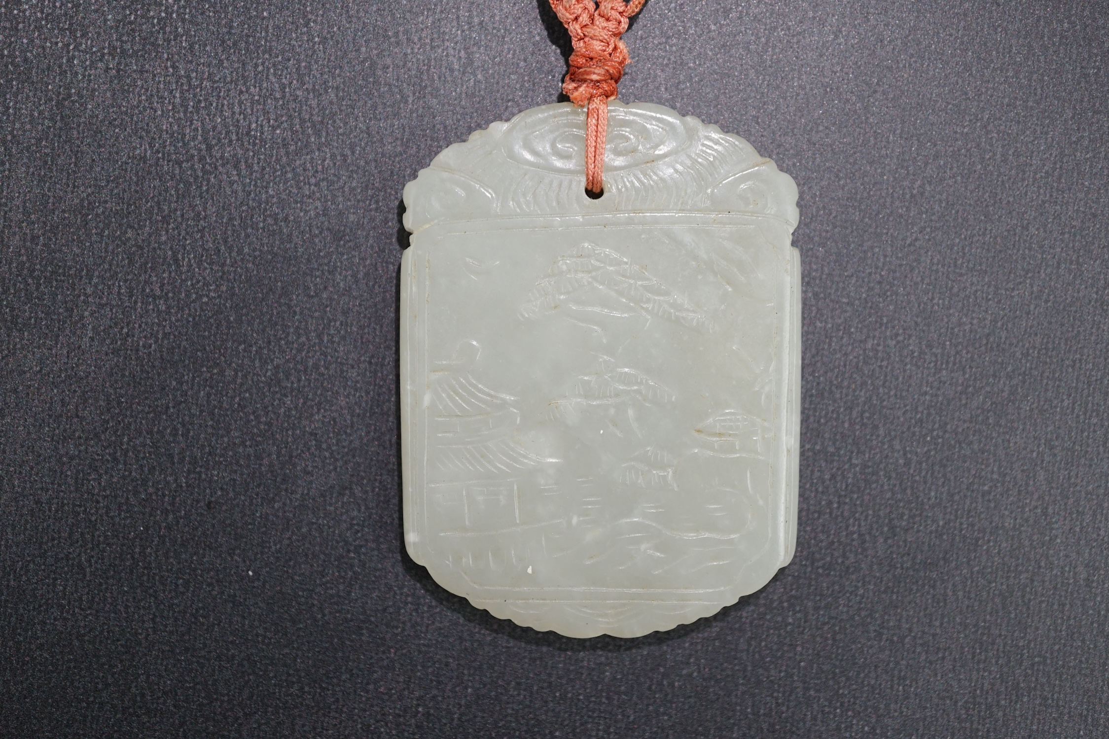 An unusual Chinese pale celadon jade plaque, 19th century